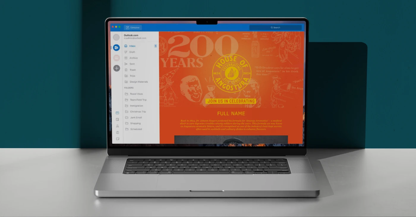 Laptop displaying a branded Angostura 200-year anniversary email.