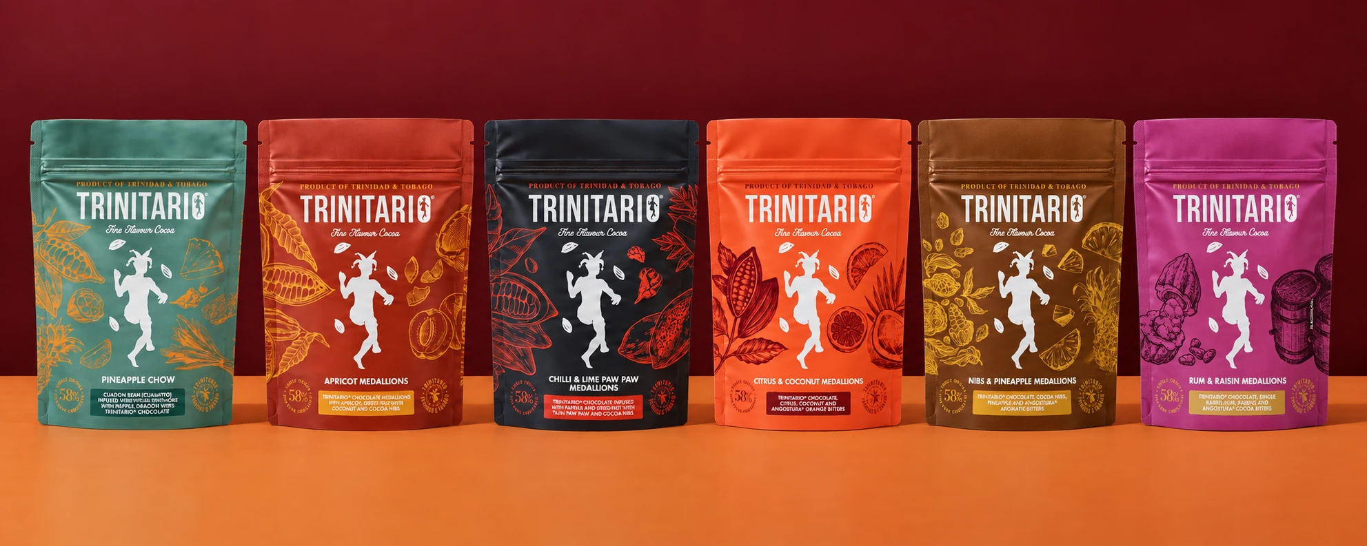 All six Trinitario medallion pouches displayed in a row on an orange surface against a deep red background.