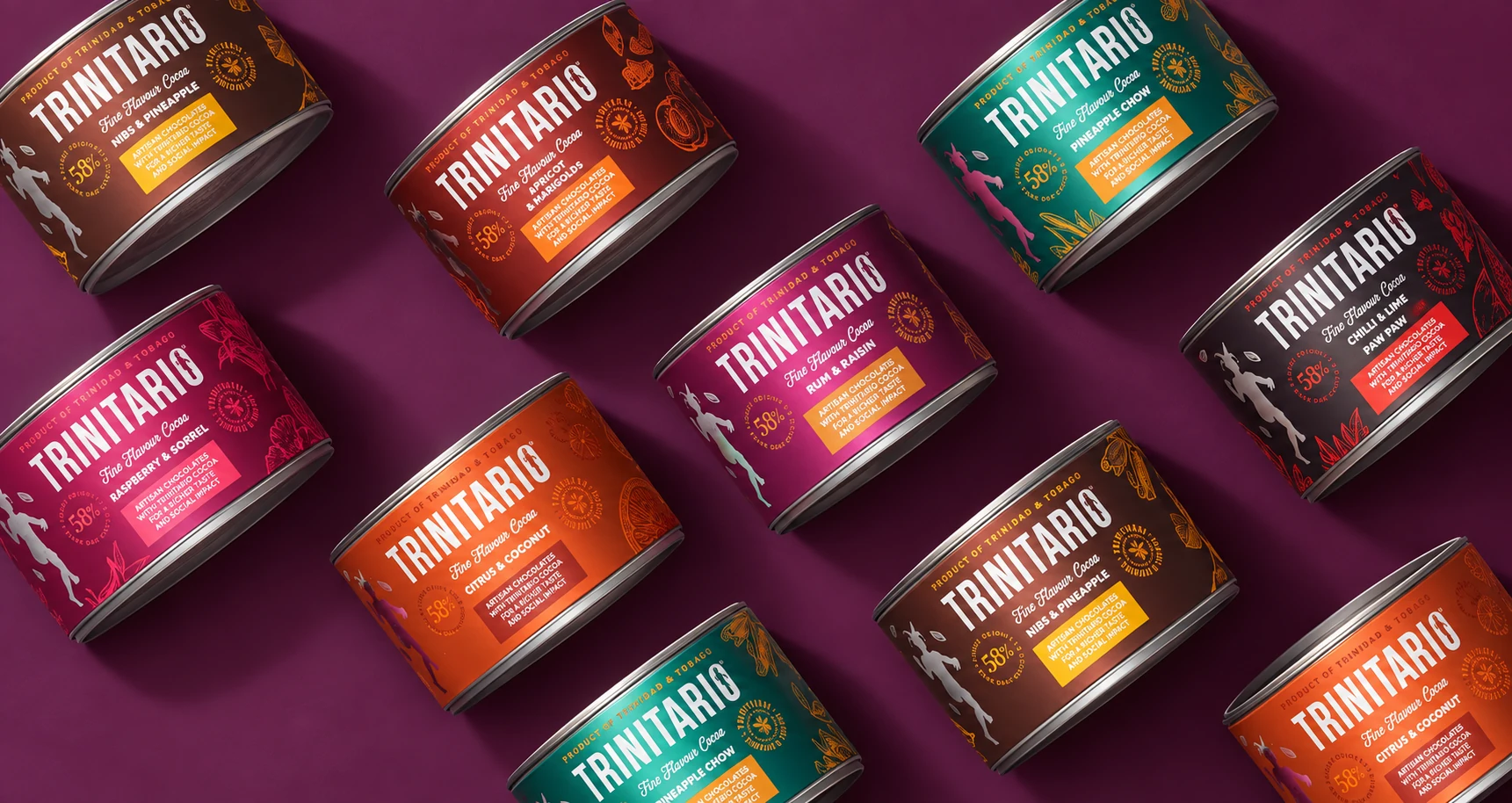 Trinitario chocolate tins arranged diagonally on a plum background, showing the redesigned range.