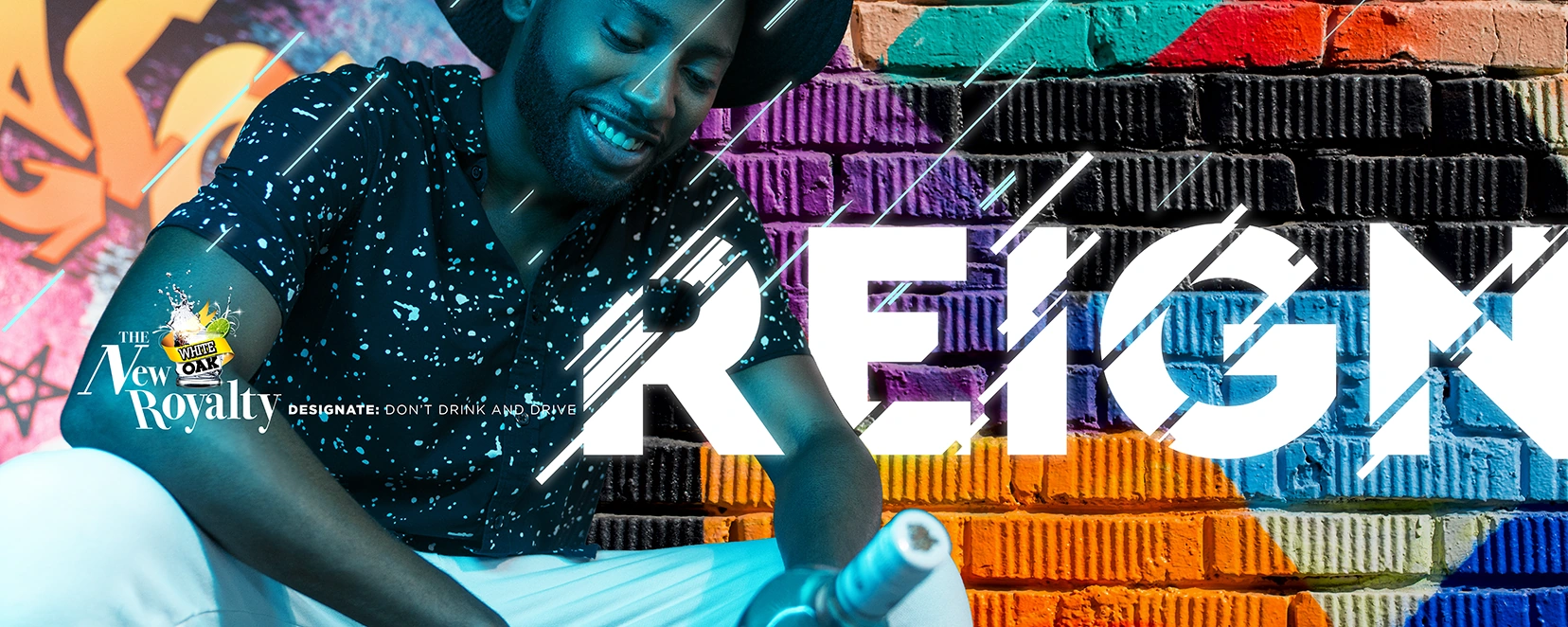 Reign outdoor artwork featuring a man wearing headphones in front of a brightly painted wall.